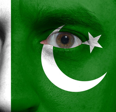 face with the Pakistan flag painted on it