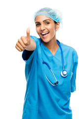 Closeup confident Indian doctor surgeon thumbs up isolated on wh