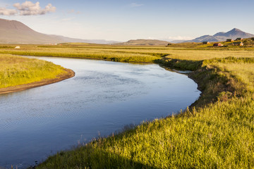 Icelandic river in background  varmahlio village.