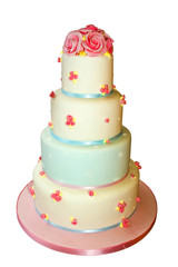 Iced four tier wedding cake isolated on white.