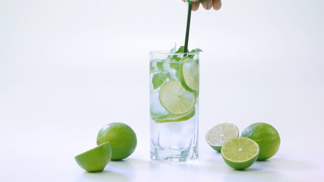 Mojito cocktail with halves of limes