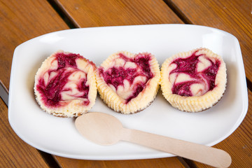 Mini raspberry cheesecakes in muffin forms