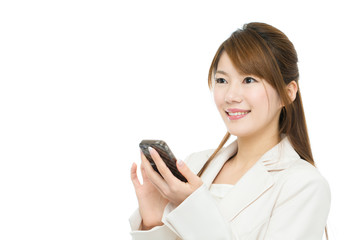 Beautiful asian businesswoman using a cellular