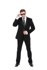 Stylish bodyguard with glasses and folded arms. Isolated