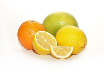 Citrus fruit with slices on a white background