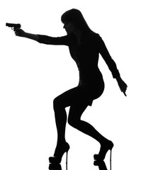 sexy detective  woman holding aiming  gun silhouette