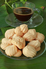 Meringue with cup coffee