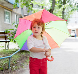  2 years child  with umbrella