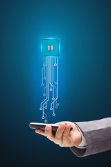 Microchip with mobile phone Holds in a hand 