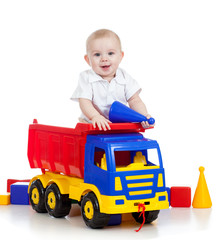 little child playing with color toys