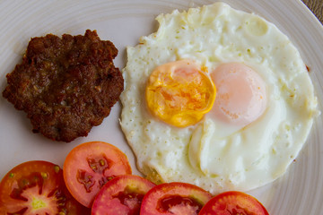Fried pork with fried two eggs
