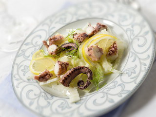 salad with octopus fennel and lemon, selective focus