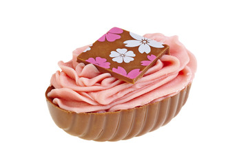 Sweet chocolate bonbon with pink cream  on white background
