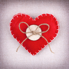 Red heart with button and bow