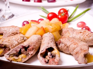 Tasty meat loafs and piece of meat with vegetables
