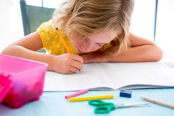 Child student kid girl writing with homework on desk