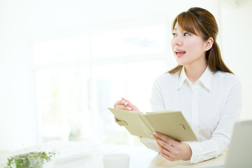 Beautiful asian businesswoman using a laptop computer