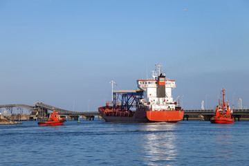 A cargo ship leaving the port of Gdansk, Poland.