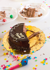 chidren end of party with half chocolate cake slices