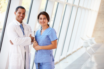 Portrait Of Medical Staff In Corridor Of Modern Hospital