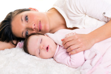 Baby girl sleeping with mother care near