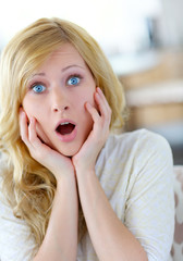 Blond woman with surprised look on her face