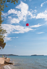 Flying on a parachute over the sea. Croatia