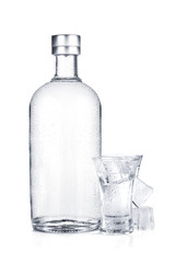 Bottle of vodka and shot glass with ice