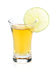 Shot of gold tequila with lime slice