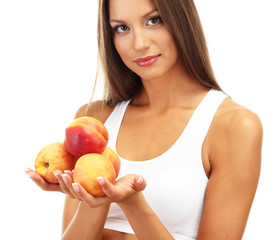 beautiful young woman with  peaches, isolated on white