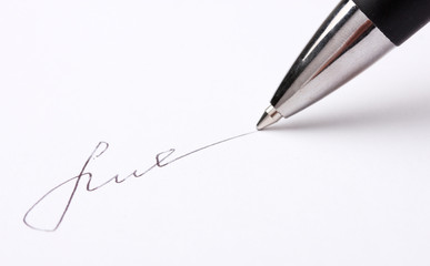 Closeup of signature (fake, not real) and pen, isolated on