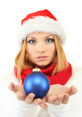 Attractive young woman holding Christmas ball isolated on white