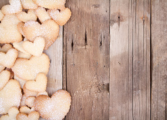 Heart shaped cookies on wooden background