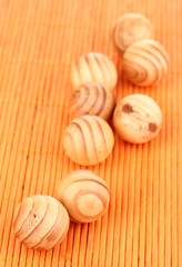 Wooden balls on bamboo mat