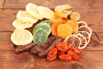 Dried fruits on wooden background