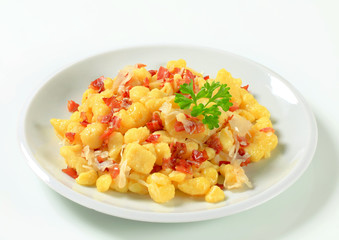 Small potato dumplings with bacon and cabbage