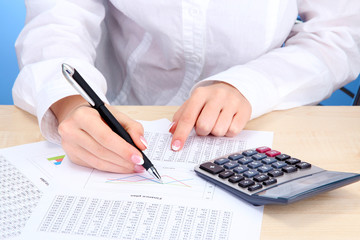 Closeup of businesswoman hands, working in office room