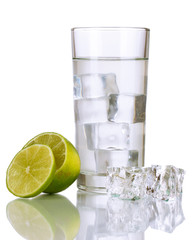 Ice cubes in glass with lime isolated on white