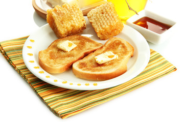 White bread toastwith honey on plate, isolated on white