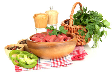 Raw beef meat in bowl with herbs and spices isolated on white