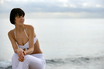 Contemplative woman by the sea