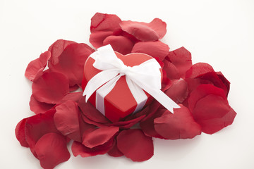 Valentines Day gift in red box with rose petal