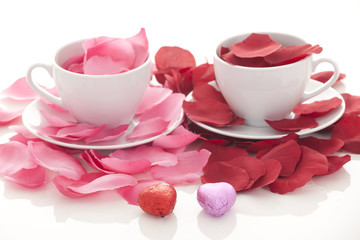 Coffee cup and rose petals 