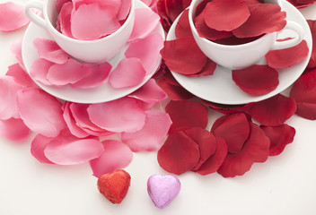 Coffee cup and rose petals 