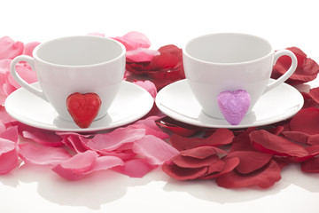 Coffee cup and rose petals 