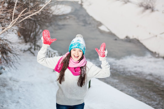 Smiling girl on snow winter background