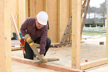 Man sawing wood