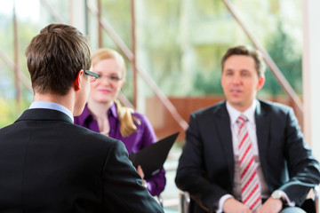 Man having an interview with manager and partner employment job