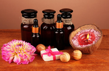 ingredients for soap making on brown background