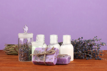 ingredients for soap making on violet background